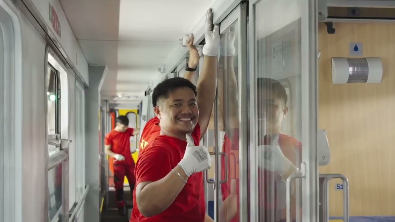 A RegioJet colleague cleaning a train corridor, a still from the recruitment video